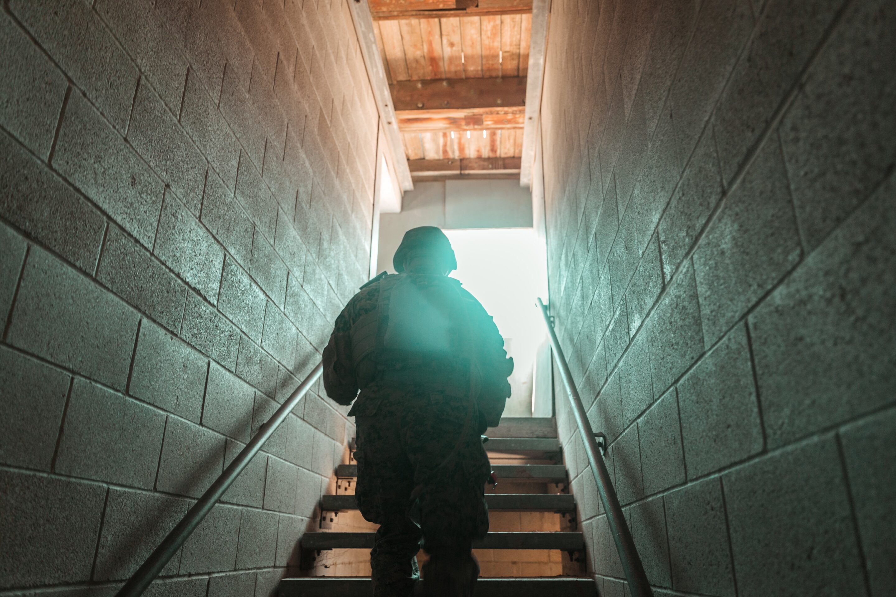 military officer running up a flight of stairs